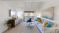 Located at 15123 Brookhurst St in Westminster, CA, this 1-bedroom, 2-bathroom residence offers a thoughtfully designed single-floor layout that maximizes comfort and functionality. The living room is a standout space, showcasing striking vaulted ceilings with exposed wood beams that lend architectural character and a sense of openness. Plush carpeting and a sliding glass door lead directly to a private balcony, inviting natural light and outdoor views into the heart of the home. The kitchen is efficiently laid out with white cabinetry, stone-tone countertops, a double-basin sink, and recessed lighting, complemented by wood-look flooring and large vertical-blind windows that bring in ample daylight. A dedicated dining area sits adjacent to the kitchen for seamless entertaining. The spacious bedroom features soft carpeting, a generous window overlooking a greenery-filled exterior, and direct access to a dedicated closet, providing practical storage. Two bathrooms serve the residence — one featuring a full tub-shower combination with a patterned accent wall, and a second appointed with white cabinetry and granite-tone countertops. Throughout, crisp white walls and warm wood-tone flooring create a clean, cohesive aesthetic well-suited to Southern California living.