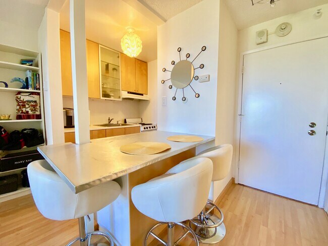 Bar stools overlooking Kitchen - 6 Captain Dr