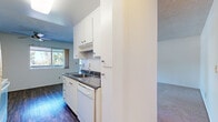 Located at 804 Hancock St in Hayward, California, this single-floor, one-bedroom, one-bathroom residence offers a practical and comfortable layout. The open-plan living and dining area is generously sized, featuring soft carpeting, a textured ceiling, and large sliding glass doors that open to a private balcony with outdoor views — allowing natural light to fill the space throughout the day. An additional window further brightens the living area.

The kitchen is efficiently designed with a galley-style layout, featuring white cabinetry, dark countertops, hardwood-style flooring, and a full suite of white appliances including an electric range, microwave, refrigerator, and dishwasher. Ample upper and lower cabinet storage makes the kitchen both functional and organized.

The bedroom is a well-proportioned retreat with plush carpeting, a natural light window, and a wide mirrored sliding-door closet that adds depth and storage capacity to the room.

The bathroom is clean and updated, offering a white vanity with dark countertop, a large mirror, hardwood-style flooring, and a window for natural ventilation. The overall aesthetic throughout the residence is bright, neutral, and move-in ready.