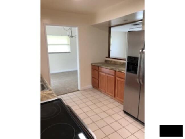 Photo - Large Corner Lot, Fenced in Yard, New Flooring, Fresh Paint, Lawn Care Included! House