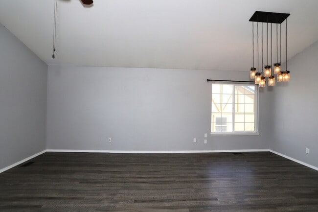 Photo - Spacious 4-Bedroom Home with Open Concept Living, Mountain Views & Fenced Yard