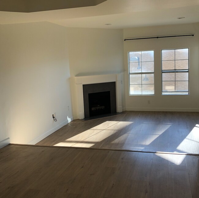 Dining room and sunken living room with spectacular light. - 716 Maltman Ave