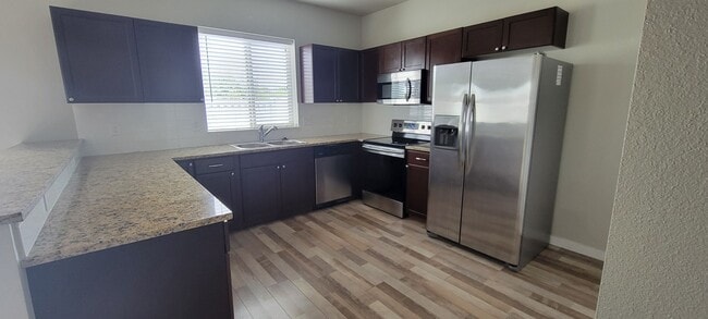 Building Photo - "Luxury Living: Stunning End Unit Townhome...