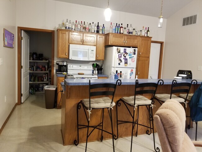High-back Kitchen Bar with Bar Stools - 702 Vattier St