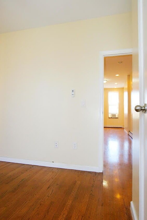Photo - "Charming 1-Bedroom Haven with Granite & Hardwood Elegance at 305 W 123rd St, NYC!"
