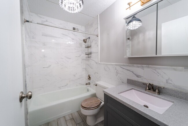 Bathroom with tile all around - 2015 S Finley Rd