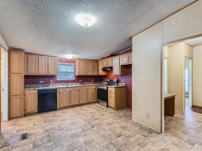 Foto del edificio - 6125 Saddler Ln