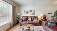 This single-floor, 2-bedroom, 1-bathroom residence at 1451 Clough St in Bowling Green, Ohio offers a functional and well-organized layout. The entrance opens toward a carpeted living room that provides a comfortable, open feel, with a window allowing natural light to brighten the space. Textured ceilings are consistent throughout the common areas, adding a classic residential character.

The kitchen is laid out in a galley style, featuring warm oak cabinetry, a double-basin sink, white appliances including a refrigerator and range, and tile flooring. A separate dining area adjoins the kitchen, supporting everyday convenience. The living and dining areas flow naturally together, making efficient use of the available space.

The primary bedroom is a well-proportioned room featuring carpeted floors, two double closets with wood bi-fold doors, offering notable storage capacity. The secondary bedroom includes carpeted floors and a window with exterior views, and is well-suited as a guest room or home office. The shared bathroom features tile flooring, a wood-framed vanity mirror, and a louvered closet door providing additional storage access directly from the hallway.