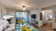 Located at 4950 E Van Buren St in Phoenix, Arizona, this single-story residence offers a thoughtfully designed layout that balances comfort and functionality. The open living room is a welcoming focal point, featuring wood-style flooring, a ceiling fan, and a sliding glass door with vertical blinds that opens to a private outdoor patio, allowing natural light and views of surrounding greenery. Adjacent to the living area, the dining space is defined by a pendant light fixture and a mirrored wall that enhances the sense of depth and openness.

The kitchen is well-equipped with warm wood cabinetry, granite-style countertops, black appliances including a refrigerator, range, and built-in microwave, and tile flooring. A dedicated in-unit laundry closet is conveniently accessible directly from the kitchen. Two bedrooms provide comfortable retreats; the primary bedroom features carpet flooring, a ceiling fan, and a window with outdoor views, while the secondary bedroom offers similar natural light. Two bathrooms mirror the kitchen's design aesthetic, each featuring granite-style countertops, wood cabinetry, and wood-style flooring. One bathroom includes a soaking tub and shower combination, while the other offers a streamlined vanity setup, making this home practical and polished throughout.