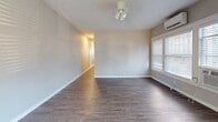 This compact yet well-designed apartment in Saint Petersburg, FL, maximizes its 630 square feet of living space. The single-floor layout comprises one bedroom, one bathroom, a kitchen, a living room, and two hallways. The primary bedroom, measuring 100 square feet, offers a cozy retreat.

Throughout the apartment, modern wood-look flooring creates a cohesive and contemporary aesthetic. Large windows with white blinds allow natural light to flood the spaces, enhancing the sense of openness. The neutral wall colors contribute to a fresh and inviting ambiance.

The kitchen boasts a sleek design with white cabinetry, granite countertops, and stainless steel appliances. It features a window above the sink, providing natural light and ventilation. The bathroom showcases a clean, modern look with white subway tiles and a decorative mosaic border.

The living area is open and versatile, ideal for various furniture arrangements. Built-in closets offer practical storage solutions. The apartment's efficient layout and updated finishes make it an attractive option for those seeking a modern living space in a prime Florida location.