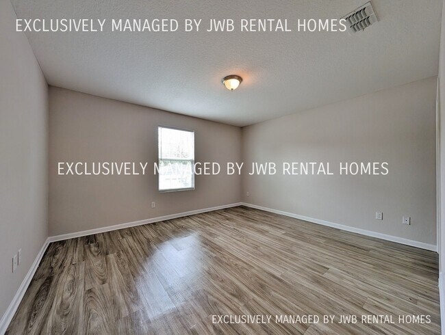 Building Photo - 8509 McGirts Village Ln