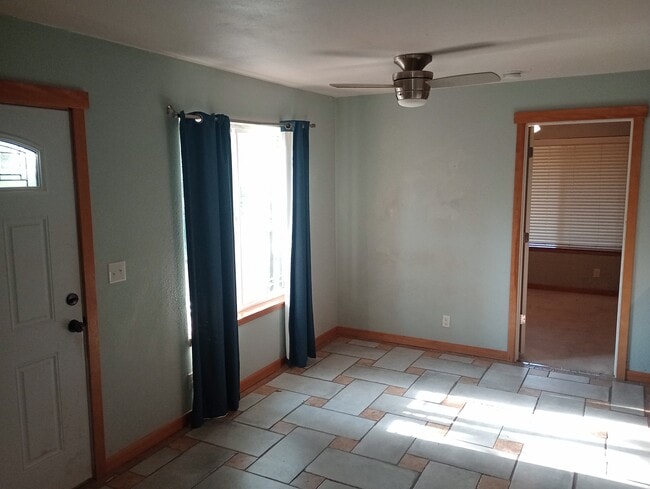 Living area, door outside and to the bedroom - 3921 E 15th Ave