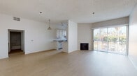 Located at 500 S Lake St in Los Angeles, CA, this single-floor residence offers a clean, functional layout with a bright and open feel throughout. The main living and dining area is generously proportioned, featuring light wood-style flooring, a textured ceiling, a pendant light fixture, and a fireplace. A sliding glass door opens to a balcony, bringing in natural light and glimpses of the surrounding neighborhood greenery.

The kitchen is efficiently designed with white cabinetry, dark countertops, a gas range, a dishwasher, and a sink. A large vertical window frames views of palm trees outside, filling the space with natural light.

The bedrooms are carpeted and offer a calm, comfortable atmosphere. Each room includes mirrored sliding closet doors that visually expand the space, along with windows that provide additional natural light and ventilation.

The bathroom features a full tub and shower combo with white tile surround, a toilet, and a separate vanity area with a countertop sink, white cabinetry, and a wall mirror. The flooring throughout the wet areas continues the light wood-style material seen in the main living spaces, maintaining a cohesive aesthetic across the unit.