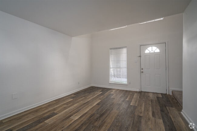 1BR, 1.5BA - 820SF - Living Room - Springwood Park Apartments