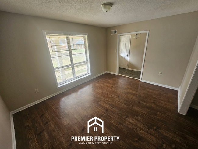 Photo - Charming 3BR/2BA Home in 38115 | Hardwood Floors, Fireplace & 2-Car Garage