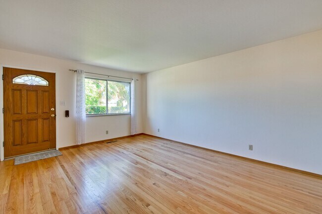 Building Photo - Newly Landscaped Backyard- Hardwood Floors...