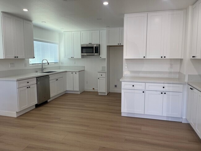 Kitchen has dishwasher, microwave and hook ups for refrigerator and stove. - 3110 E Thompson St