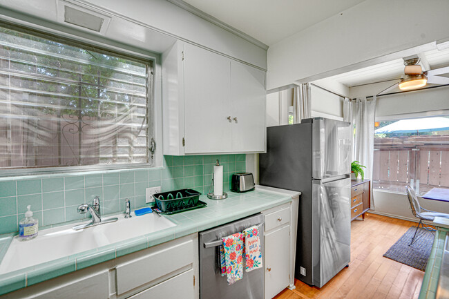 Retro freshly painted kitchen with brand new dishwasher/efrigerator/washer dryer - 4268 Troost Ave