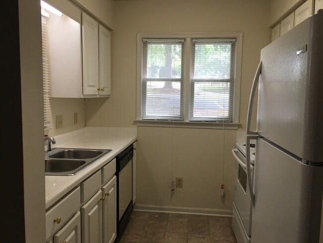 Building Photo - ONE LEVEL CONDO NEAR REX HOSPITAL -Firepla...