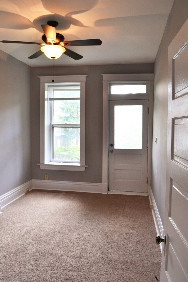 Bedroom 2 with exit to patio and backyard. - 3445 Shenandoah Ave