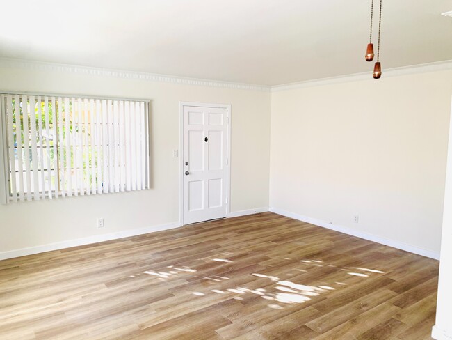 Living room area - new flooring through-out - 4153 Marlton Ave