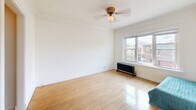 Located in Minneapolis's Loring Park neighborhood, this single-floor unit blends classic architectural character with comfortable, functional living. Throughout the space, warm hardwood floors and crisp white walls create a bright, clean aesthetic, while elegant crown molding adds a timeless finishing touch.

The living area is generously proportioned, filled with natural light through a large window that frames views of the surrounding neighborhood. A ceiling fan with a classic fixture anchors the room, and a vintage cast-iron radiator beneath the window serves as both a functional heating element and a charming period detail.

The bedroom offers a calm and understated retreat, with the same warm hardwood flooring and white walls continuing from the main living area. Closet access and a doorway connecting to adjacent spaces provide practical flow throughout the unit.

The bathroom is a standout feature, showcasing a classic clawfoot bathtub that speaks to the building's historic character. Classic hex-tile flooring and clean white walls complete the space, lending it a timeless, vintage appeal.

Overall, this unit offers a cohesive blend of historic charm and everyday functionality, with architectural details that reflect the building's heritage while providing a comfortable, livable environment in the heart of Minneapolis.
