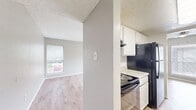This well-designed apartment offers 760 square feet of living space on a single floor, featuring two bedrooms and two bathrooms. The primary bedroom is generously sized at 140 square feet, providing ample space for comfort and relaxation. Throughout the apartment, wood-look flooring adds warmth and elegance to the space.

Large windows in the bedrooms and living area allow natural light to flood the rooms, creating a bright and airy atmosphere. Ceiling fans are installed in multiple rooms, enhancing air circulation and comfort. The living room is spacious, ideal for entertaining or relaxing.

The apartment includes a dedicated laundry area, adding convenience to daily life. The bathrooms feature clean, white fixtures and wood-look flooring that complements the overall design. A hallway connects the various rooms, ensuring a smooth flow throughout the space.

Storage is thoughtfully incorporated with a closet, helping to keep the living areas clutter-free. The neutral color palette of the walls provides a versatile backdrop for personal decorating styles. Located in the Addison Apartments At The Park complex in Addison, TX, this apartment combines modern amenities with a practical layout, making it an attractive option for those seeking a comfortable living space.