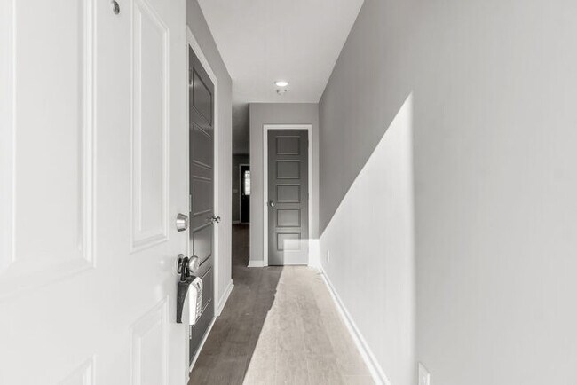 Building Photo - 301 Longshadow Trail - Model Townhome