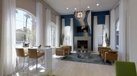 This sophisticated single-floor space makes an immediate impression with its soaring ceilings and expansive, light-filled interior. Tall arched windows dressed in crisp white floor-to-ceiling drapes line the walls, flooding the space with natural light and creating an airy, open atmosphere. A striking blue accent wall serves as the focal point of the main lounge area, anchored by a floor-to-ceiling tiled fireplace adorned with an eye-catching geode-style art piece and a mounted flat-screen television above. A sculptural sputnik chandelier hangs overhead, adding a glamorous, contemporary touch to the room. The seating area is thoughtfully arranged with modern caramel leather armchairs around a sleek stone-top coffee table, all set atop a richly patterned area rug. Adjacent to the lounge, a high-top bar counter with backless stools provides an additional gathering spot, ideal for casual conversation or work. The light-toned tile flooring runs throughout, complementing the neutral wall tones and contrasting beautifully with the deep blue accents. Lush indoor plants are strategically placed throughout, introducing a refreshing organic element. The overall ambiance is modern, upscale, and welcoming — a well-appointed communal or reception space designed for both comfort and visual impact.
