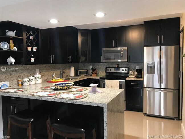 Foto del edificio - 2 br, 2 bath Condo - 8810 SW 132nd Pl # 108DN