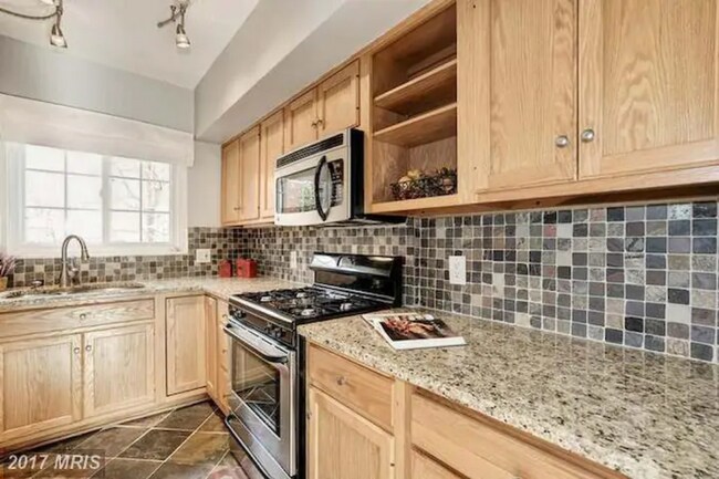 Updated, modern kitchen with gas burning stove - 1637 Mount Eagle Pl