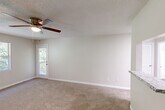 Located at 1159 Harrison Pike in Cleveland, Tennessee, this single-floor, one-bedroom, one-bathroom home offers a well-organized and functional layout. The living room features neutral-toned carpet, a ceiling fan with light fixture, a textured ceiling, and a door providing direct access to a private patio with outdoor views — allowing natural light to fill the space. The kitchen is thoughtfully updated with crisp white shaker cabinets, granite-look countertops, a subway tile backsplash, and wood-look vinyl plank flooring. It is equipped with stainless steel appliances including a dishwasher and electric range, as well as a black refrigerator. A skylight adds additional brightness to the kitchen area. The generously sized bedroom is carpeted and features a window with natural light, a textured ceiling, and a door connecting to the bathroom for added convenience. The full bathroom includes a tub-shower combo with a curved curtain rod. The home also includes two closets — one of which is a walk-in with wire shelving — as well as a dedicated laundry area. Clean, neutral finishes throughout create a cohesive and move-in ready atmosphere.