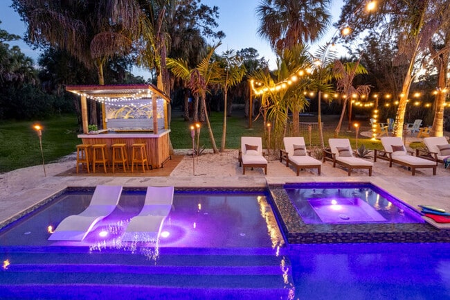 Building Photo - #1 Largest Tampa Private Compound  11BR Sl...