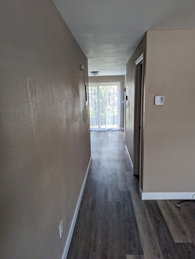 Hall to kitchen/dining - 1/2 bath to the right - 3526 Butternut Dr