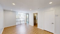 Located at 1000 Crystal Lake Cir in Macon, Georgia, this 2-bedroom, 1-bathroom home offers a thoughtfully laid-out single-floor design that maximizes every square foot. The living room is bright and open, featuring warm wood-look flooring, recessed lighting, and a large floor-to-ceiling window that floods the space with natural light and offers views of the surrounding trees. The adjacent dining room flows seamlessly into the kitchen, which is a standout feature of the home. It is equipped with white shaker-style cabinetry, granite countertops, a stainless steel range and refrigerator, and a striking mosaic tile backsplash that adds a modern touch. Both bedrooms are well-proportioned and carpeted for comfort, with recessed lighting and large windows that invite natural light. The primary bedroom includes a double-door closet, providing ample storage. The bathroom is clean and functional, featuring a full bathtub with shower and wood-look flooring that ties in with the rest of the home. Crown molding is present throughout, adding a refined finish to the overall aesthetic. This home combines practical design with updated finishes in a well-connected Macon location.