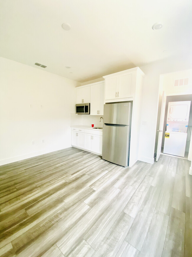 Living Room with Kitchenette and Laundry Center - 4065 Happy Camper Way