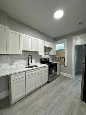 Foto del edificio - 4 Bedroom 2 Bathroom Rehabbed