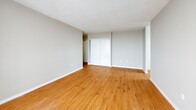 Located at 280 Wentworth St W in Oshawa, Ontario, this 2-bedroom, 1-bathroom unit offers a well-organized layout across a single floor. Warm hardwood-style flooring runs throughout the space, complemented by neutral grey walls and textured ceilings, creating a clean and cohesive aesthetic.

The living room is generously proportioned and filled with natural light from large floor-to-ceiling sliding glass doors that open directly onto a private balcony, offering open views of the surrounding cityscape. The balcony provides an ideal outdoor retreat.

The kitchen features a galley-style design with rich dark cabinetry, marble-look countertops, a tile backsplash, and stainless steel appliances including a fridge and stove. An adjacent dining area benefits from its own window, bringing in additional natural light.

Both bedrooms are comfortably sized and include sliding door closets. The primary bedroom offers elevated city views through a large window. The second bedroom is equally bright, with its own window and baseboard heating.

The bathroom is finished with crisp white wall tiles surrounding a full bathtub and shower combination, maintaining a clean and functional design.

A hallway connects the rooms efficiently, and a dedicated closet provides additional storage. The unit is practical, bright, and well-suited for comfortable urban living in Oshawa.