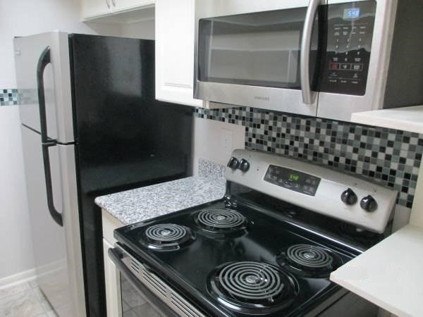 Stainless steel dishwasher, oven/range, over-the-range microwave kitchen appliances + Refrigerator - 8435 Hearth Dr
