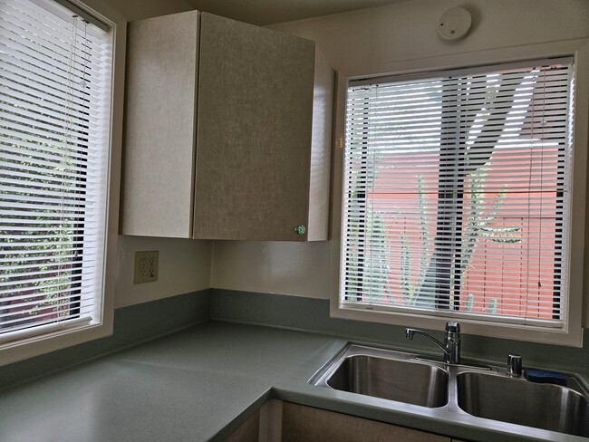 Kitchen sink area with window views to the outside - 3495 Redwood Ave