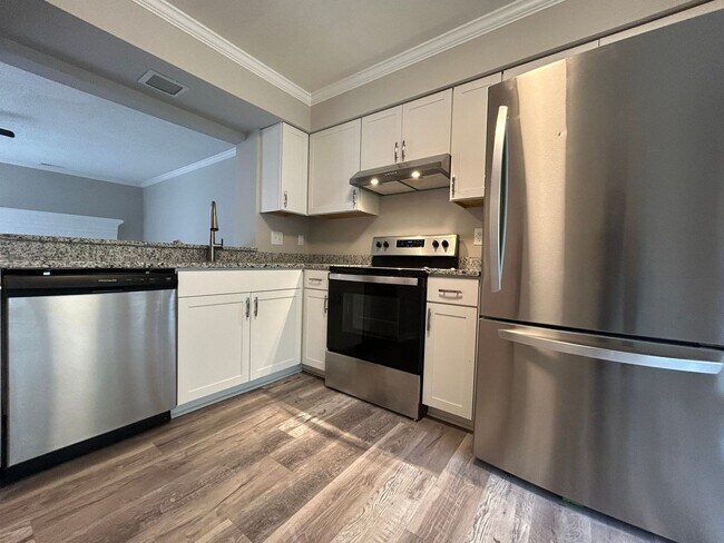 Building Photo - Introducing a charming townhome in the hea...