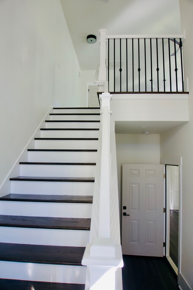 Main entrance that leads downstairs to mother in law suit and garage and upstairs to living room and - 1013 Parkwood Ave