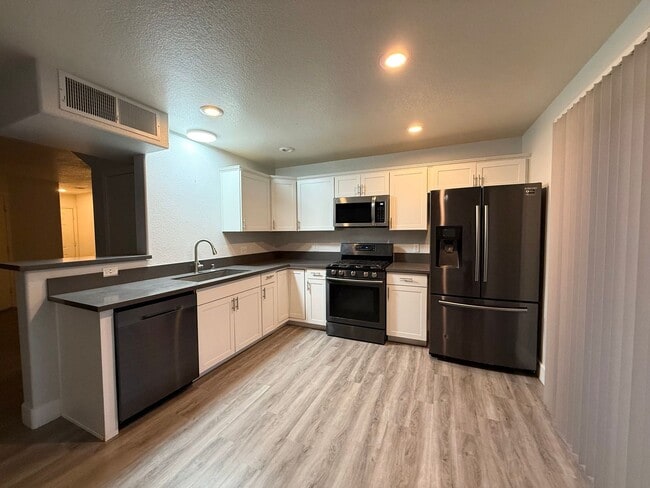 Building Photo - $300 OFF 1ST MONTHS RENT Updated 3-Bedroom Townhome in Gated Community with Pool Access