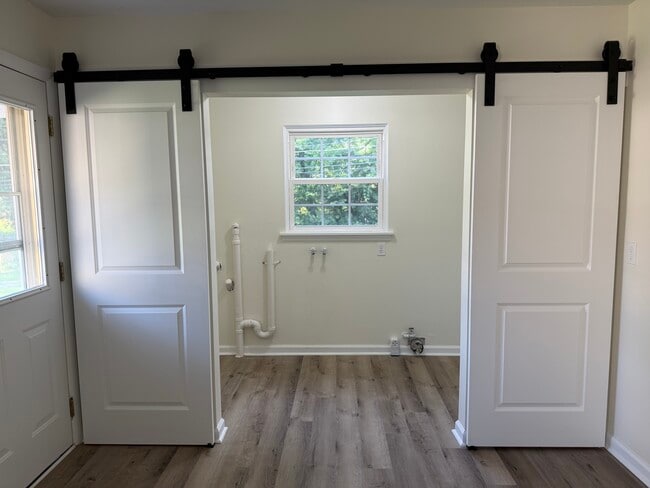 Handy laundry behind sliding barn doors - 334 Chase Rd