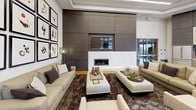 The Lane Lounge is a thoughtfully designed single-floor gathering space that seamlessly blends modern aesthetics with functional comfort. The main lounge area serves as the centerpiece, anchored by a sleek linear fireplace set within a striking floor-to-ceiling dark wood panel wall, above which a wall-mounted television is integrated for a clean, streamlined look. Plush neutral-toned sofas and ottomans are arranged around a rich, textured area rug, creating an inviting and relaxed atmosphere for socializing.

One wall is dedicated to an impressive curated gallery display, featuring a large grid arrangement of black-framed abstract artworks that adds a bold artistic character to the space. Warm hardwood flooring flows throughout, complementing the contemporary furnishings and lending a sense of warmth to the otherwise modern palette.

The kitchen area is equally refined, featuring sleek taupe cabinetry paired with stainless steel appliances, including a large French-door refrigerator. A vivid mosaic tile backsplash in tones of blue, gray, and black adds a dynamic focal point behind the gas cooktop, while white countertops provide a clean, practical workspace. Upper cabinetry with a dark wood finish mirrors the lounge's design language, tying the entire space together cohesively. Glass entry doors allow natural light to filter in, enhancing the open and welcoming ambiance of The Lane Lounge.