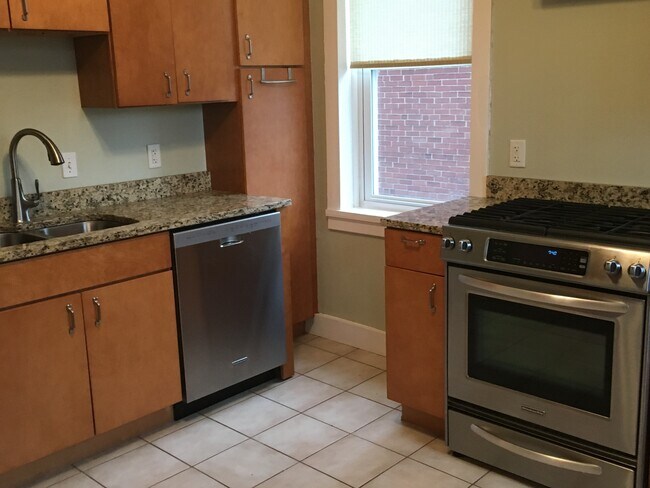 Kitchen with stainless steel appliances and countertops - 6511 San Bonita Ave