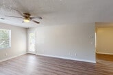 Located at 1159 Harrison Pike in Cleveland, Tennessee, this single-story home offers a practical and comfortable layout with 2 bedrooms, 3 bathrooms, and a well-organized floor plan. The living room features wood-look laminate flooring, neutral-toned walls, a textured ceiling, and a ceiling fan with light fixture. Natural light filters in through a door that leads to the patio, creating a bright and open feel. The adjacent dining area connects seamlessly to the kitchen, which is equipped with warm oak cabinetry, dark countertops, a stainless steel sink, an electric range, and a refrigerator. The bedrooms are carpeted for comfort, each featuring natural light from windows and access to closet space — with five closets throughout the home providing generous storage. The three bathrooms include wood-look flooring, oak vanities with dark countertops, large mirrors, and at least one full bathtub with shower. A dedicated laundry area and a connecting hallway round out the interior. The patio extends the living space outdoors. With a clean, neutral palette throughout, this home offers a functional and move-in ready environment in a convenient Cleveland, TN location.