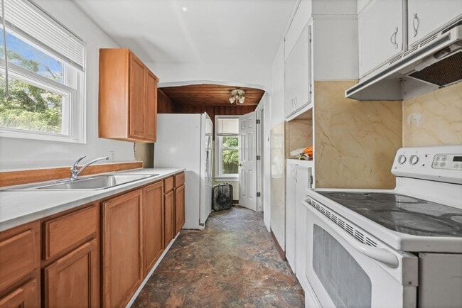 Building Photo - Bright living ? cozy dining flow for everyday comfort and easy entertaining.