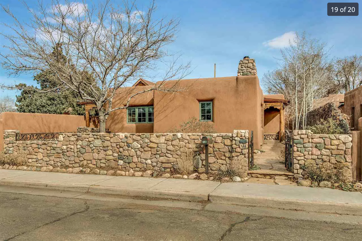 Street view of the house, with fully enclosed gates front and back - 551 Onate Pl