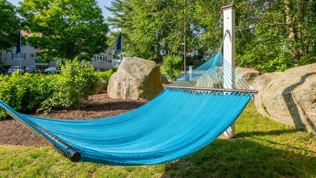 Step into a relaxation retreat in our hammock garden, a peaceful haven for lounging, dozing, or immersing yourself in a captivating book. - Welby Park Estates